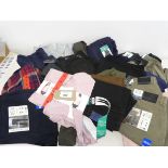+VAT Approx. 20 items of mens and womens clothing to include trousers, t-shirts, jumpers ect.
