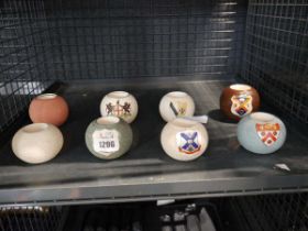 Cage containing 8 various match stick holders with strikers, some with crested ware designs