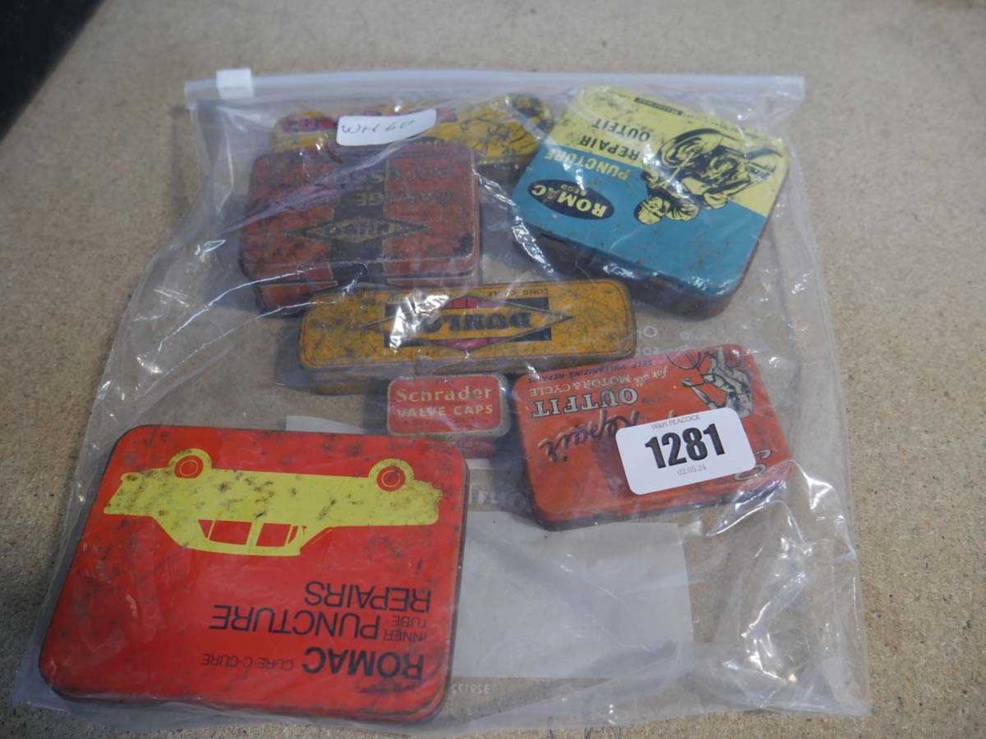 Bag of vintage tins incl. Romac puncture repair kit, Cure-C-Pure repair kit, etc.
