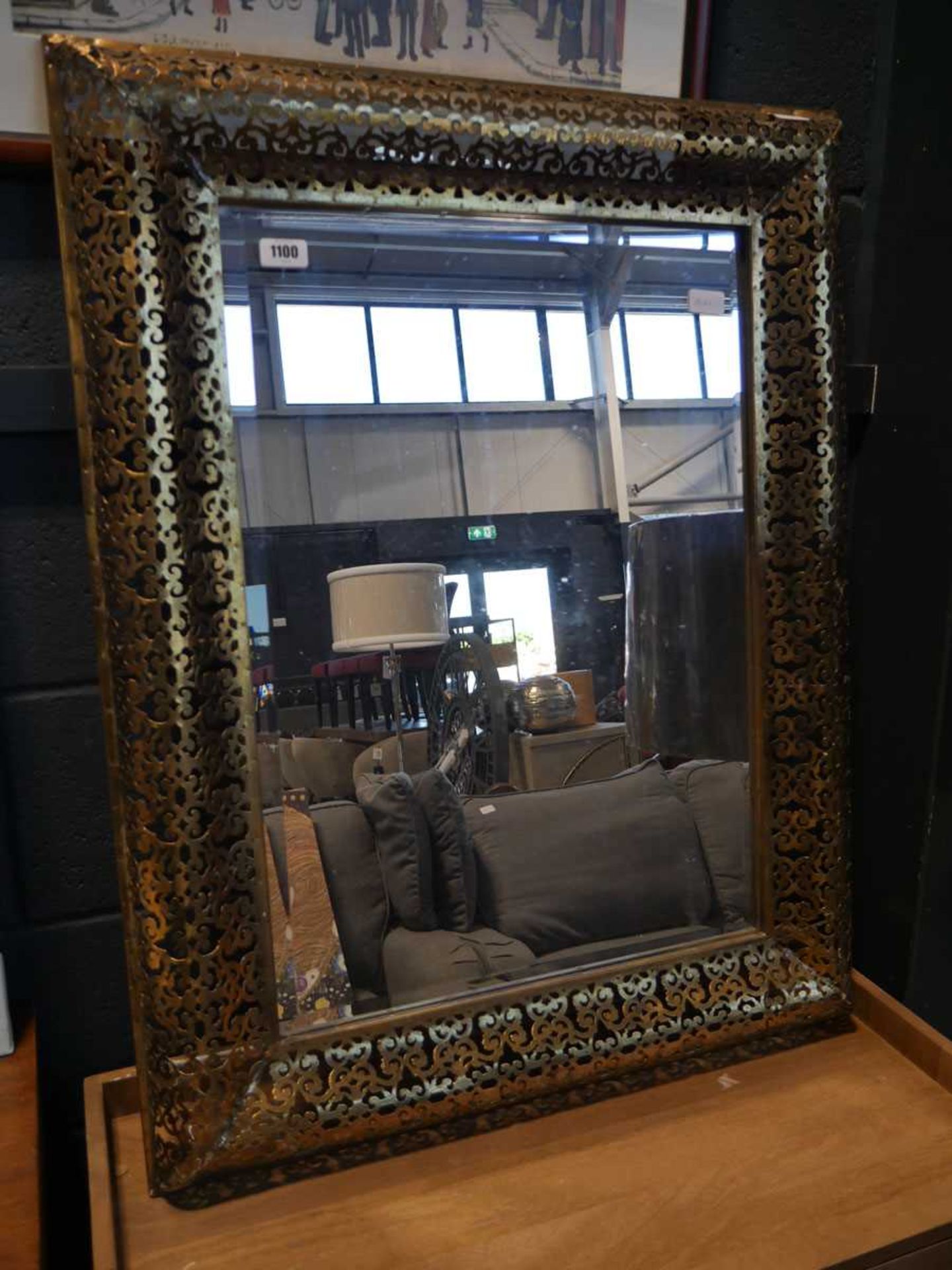 Rectangular beveled wall mirror in a brass fretwork frame