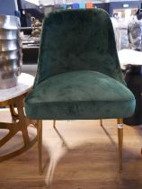 Green velvet upholstered dining chair on tapered brass finish legs