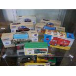 Shelf containing 7 boxed Corgi diecast vehicles incl. General Motors 4507 5th Avenue bus, AEC508