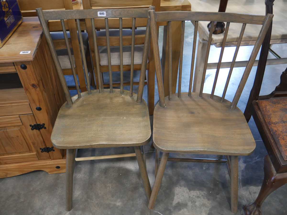 Pair of wooden panel seated stick back dining chairs