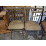 Pair of wooden panel seated stick back dining chairs