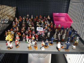 Cage containing large quantity of military and others figurines, some are metal