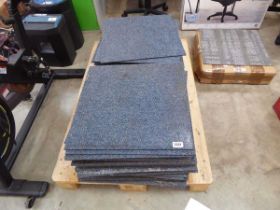 Pallet containing blue carpet tiles