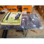 Husqvarna chainsaw bag together with a pair of Husqvarna brush cutting trousers size M