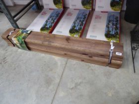 Flat pack wooden raised garden bed