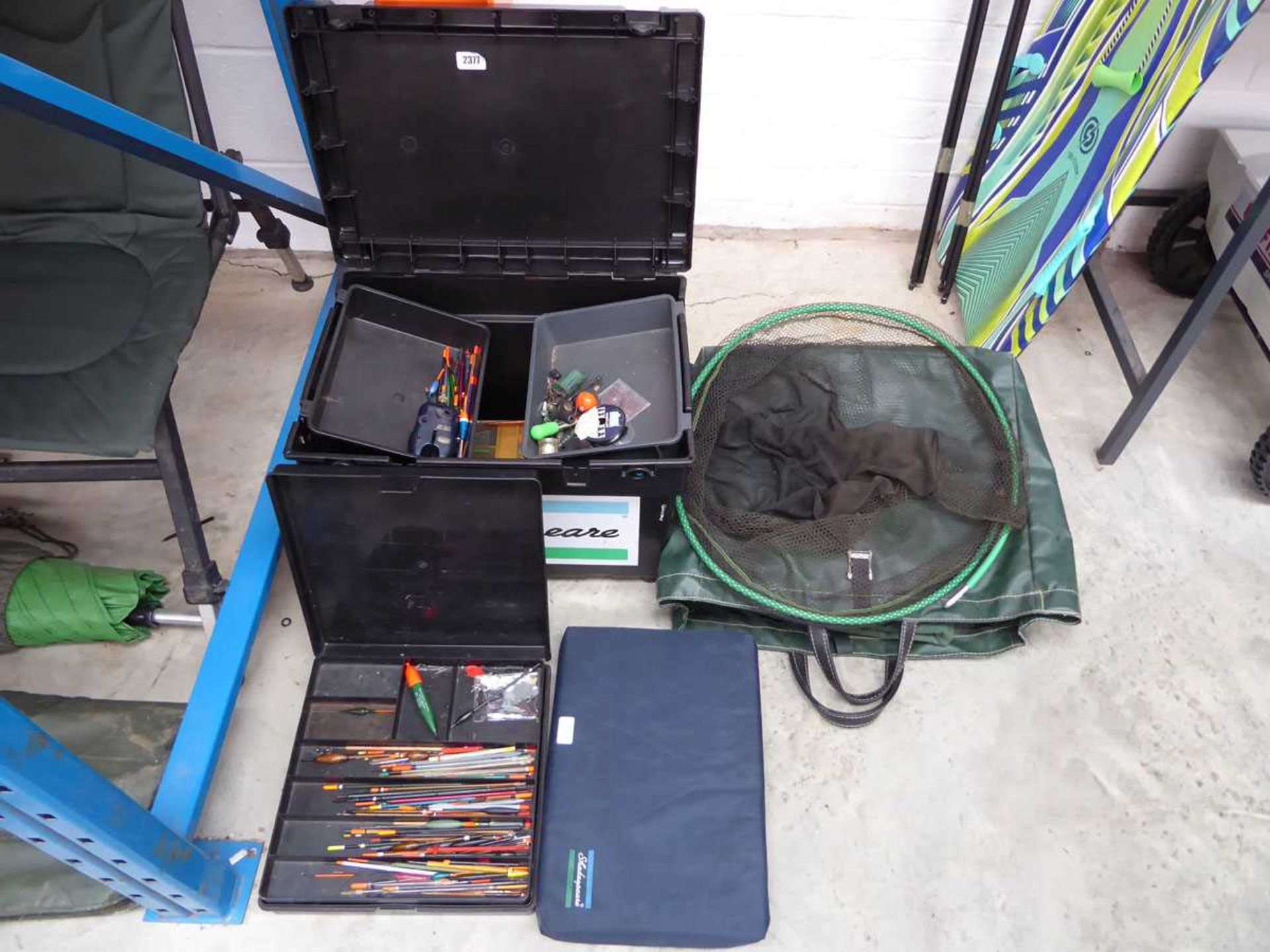 Shakespeare fishing tackle box/ seat containing various fishing tackle plus bag of with landing net,