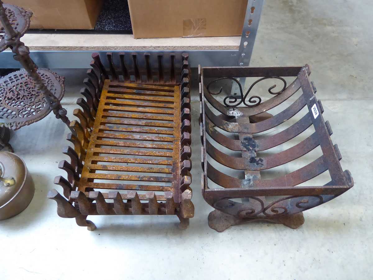 Pair of weathered decorative metal fire grates