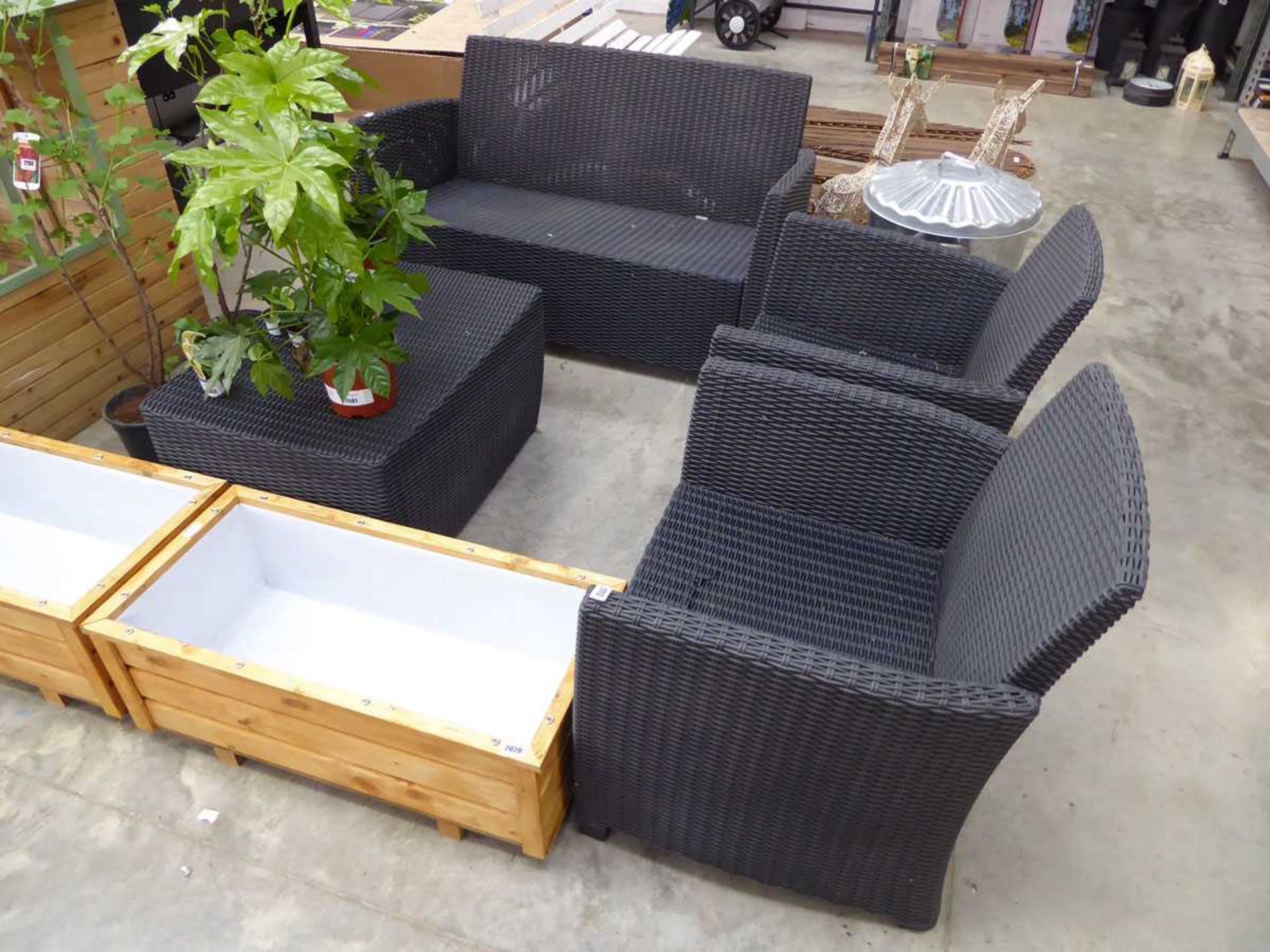 Black rattan 4 piece outdoor seating set, comprising 2 seater sofa, 2 matching armchairs and