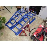 Pair of blue metal car ramps with 2 red metal axle stands