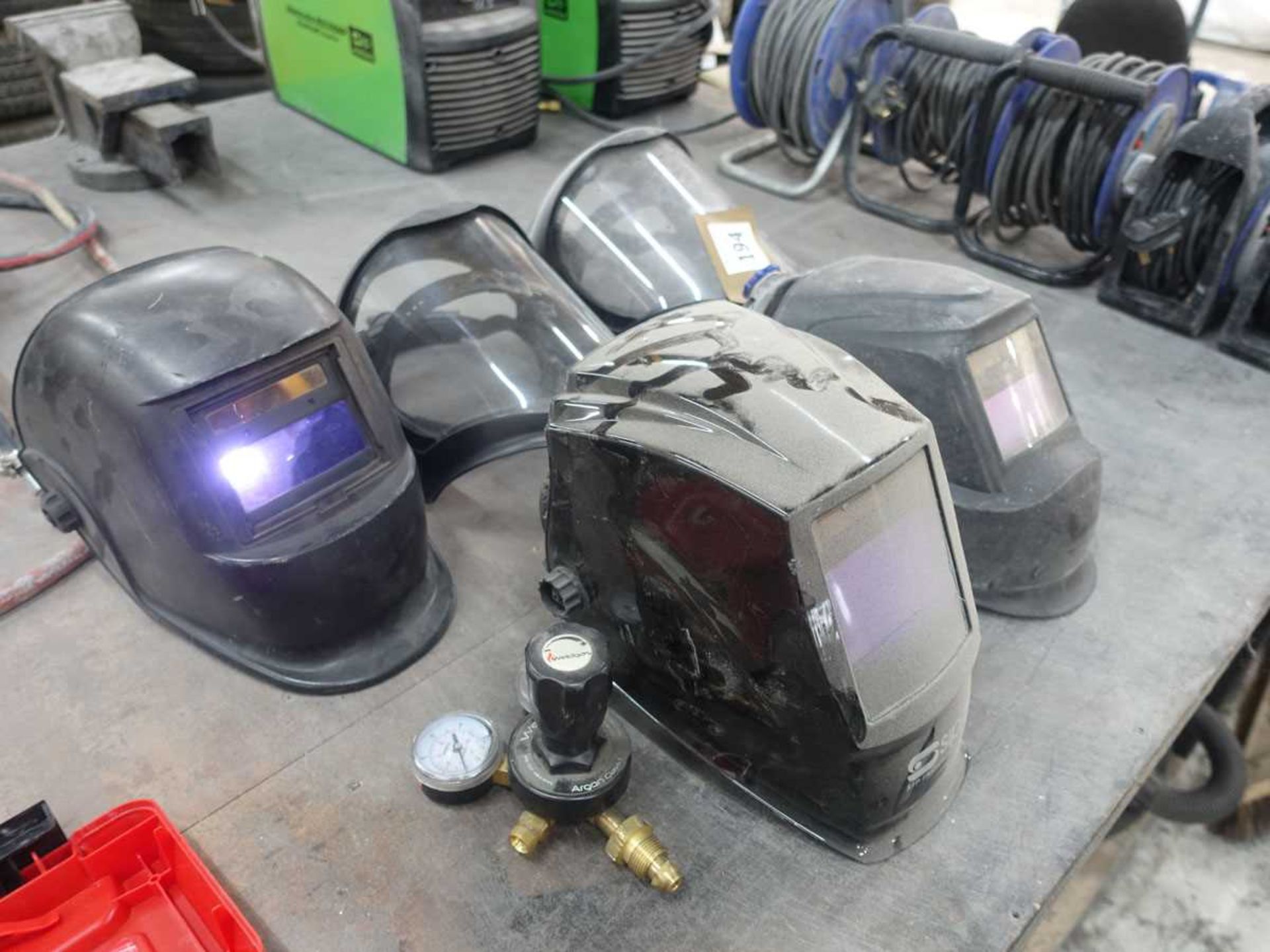 +VAT Three welding helmets, set of welding gauges and two safety masks