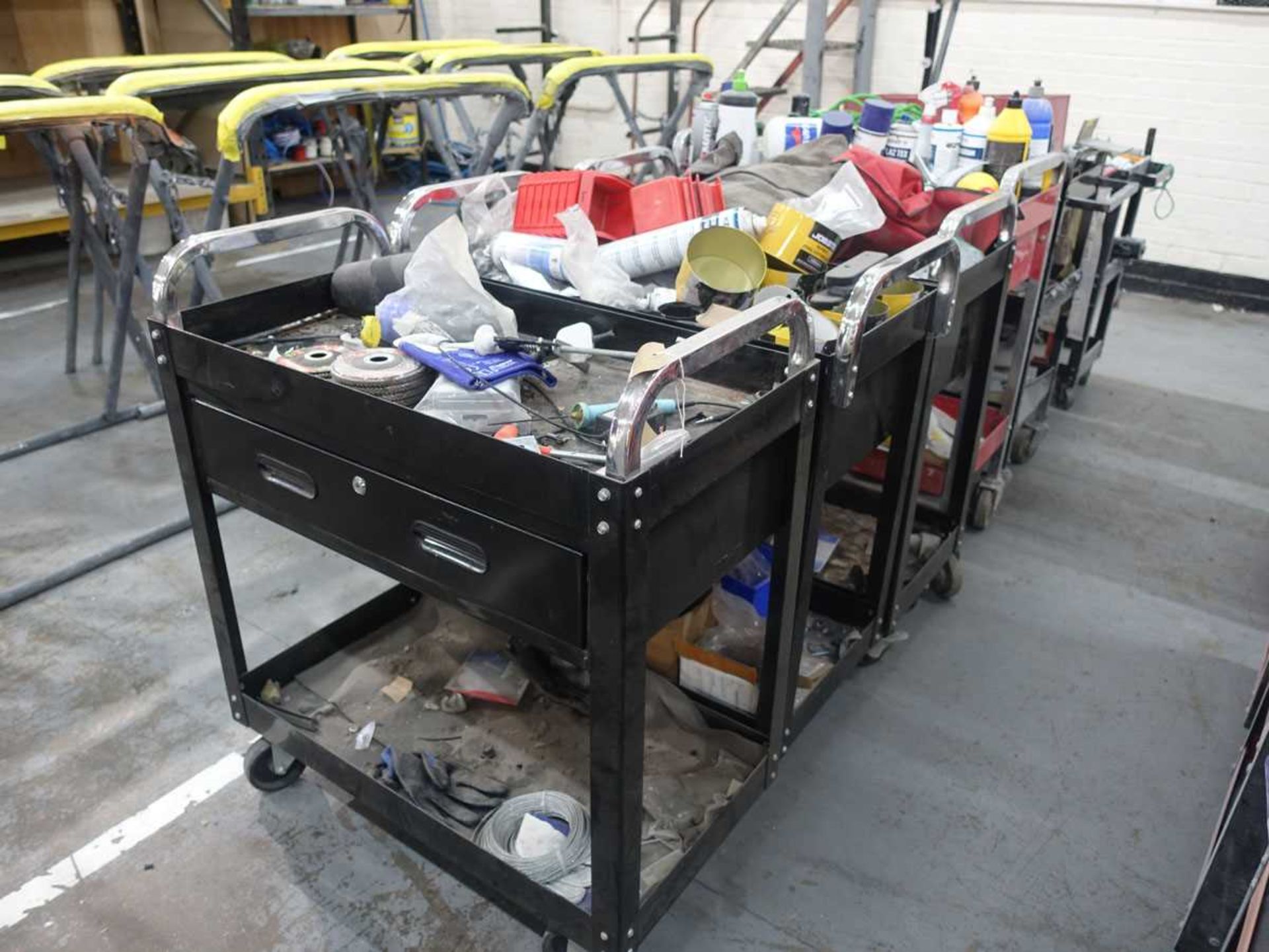 +VAT Seven steel mobile work trolleys, together with a range of parts and accessories