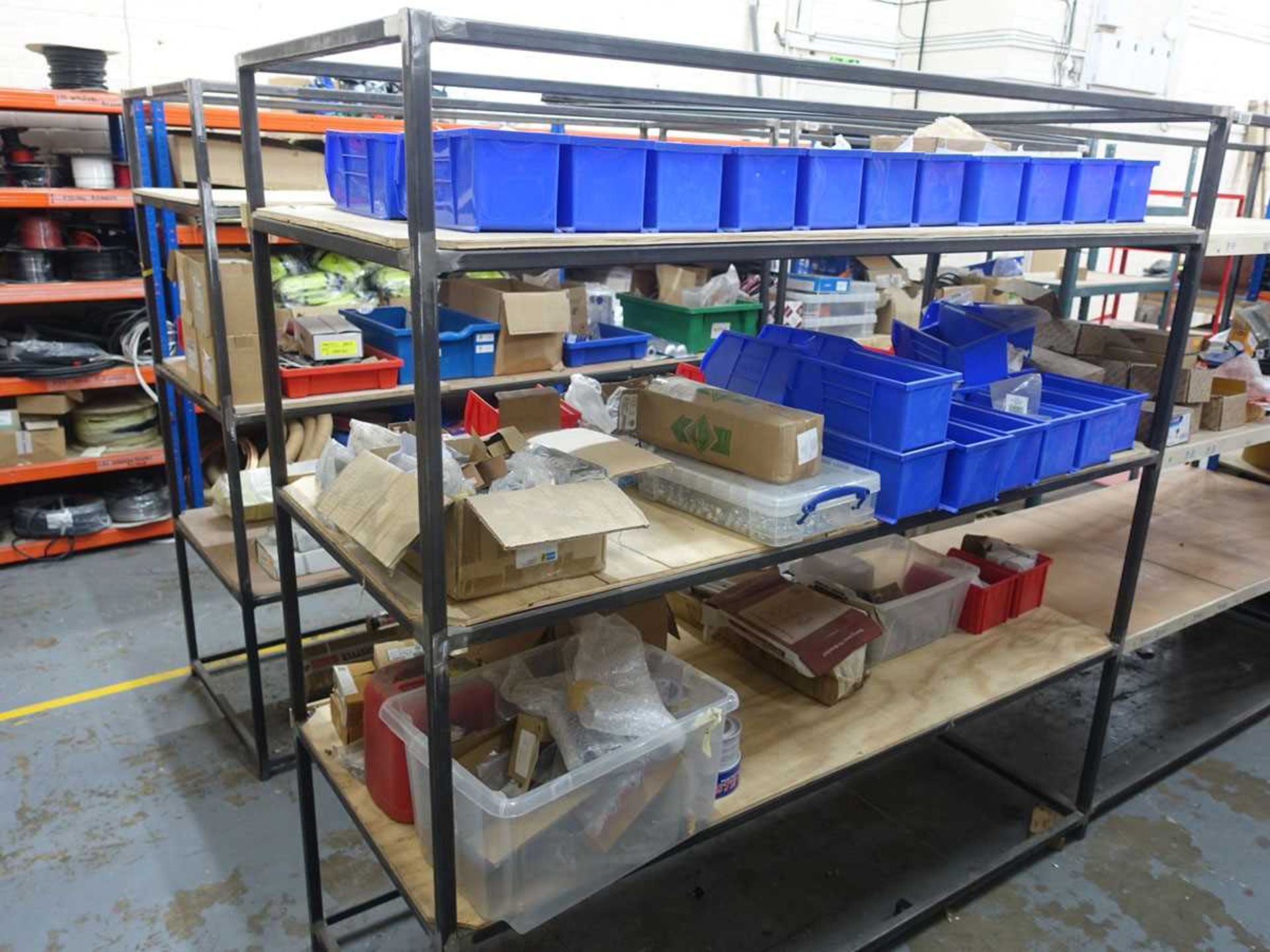 +VAT Thirteen various welded steel racks with plywood and MDF shelving (most measuring 2m long x 800