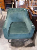 Green suede upholstered easy chair