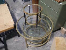 Modern nest of 2 circular glass top coffee tables in brass finish frames, together with a further