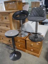 Concrete coloured suede upholstered bar stool on black metal base with black leatherette upholstered