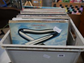 Crate containing a quantity of records to include Tubular Bells, The Moody Blues, Elvis, Status Quo,