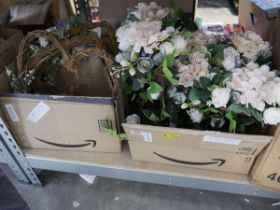 2 boxes containing floral wedding decorations in the form of lanterns and heart wreaths