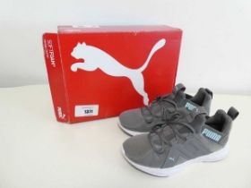 +VAT Boxed pair of Puma trainers in grey. Size 4.