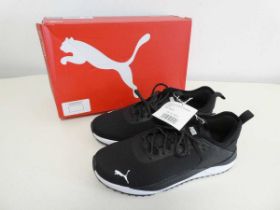 +VAT Boxed pair of Puma trainers in black. Size 8