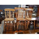 Pair of panel seated dining chairs and 1 further similar dining chair