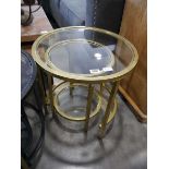 Nesting pair of brass effect framed circular occasional tables with glass surfaces