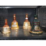 Cage containing Four Empty Bells Scotch Whisky Bottles, incl. Christmas 1995 Edition