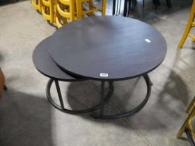Nesting pair of black ash finish circular coffee tables