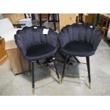 Black suede upholstered pair of shell shaped bar stools on black supports