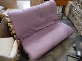 Pine double futon with purple cushion, together with a navy blue single futon cushion