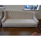 +VAT Low level beige upholstered button back sofa on black plinth type base