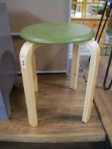 Small circular green stool on beech coloured legs