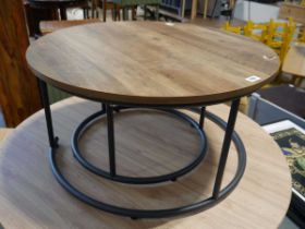 Hardwood finish nest of 2 circular coffee tables on black metal frames Upper table has damage to