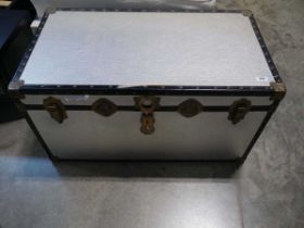 Aluminium covered black banded travel trunk