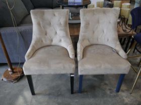 2 light brown upholstered chairs on wood effect legs