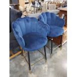 Modern pair of blue upholstered bar height stools on black supports