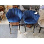 Modern pair of blue upholstered bar height stools on black supports