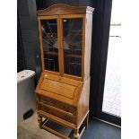 Dark oak 2 drawer bureau bookcase with leaded glass doors