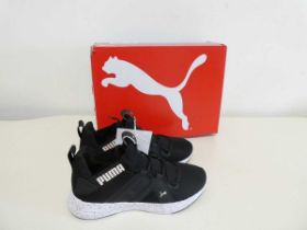 +VAT Boxed pair of Puma trainers in black. Size 4