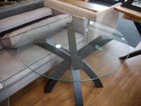 Circular glass dining table on black ash crisscross base