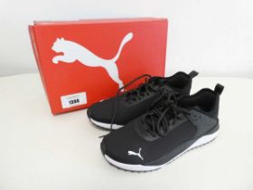 +VAT Boxed pair of Puma trainers in black. Size 8