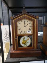 Wooden cased 8 Day Spring Clock with painted glass frontispiece, by Seth Thomas