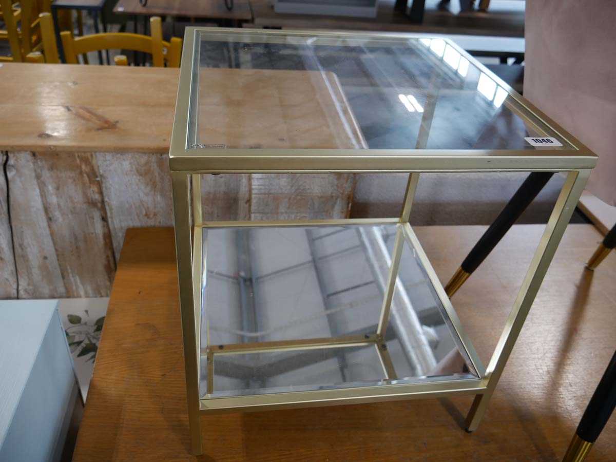 Small glass top side table in brass finish with mirrored lower shelf