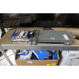 Sony DVD player with remote control and various DVDs