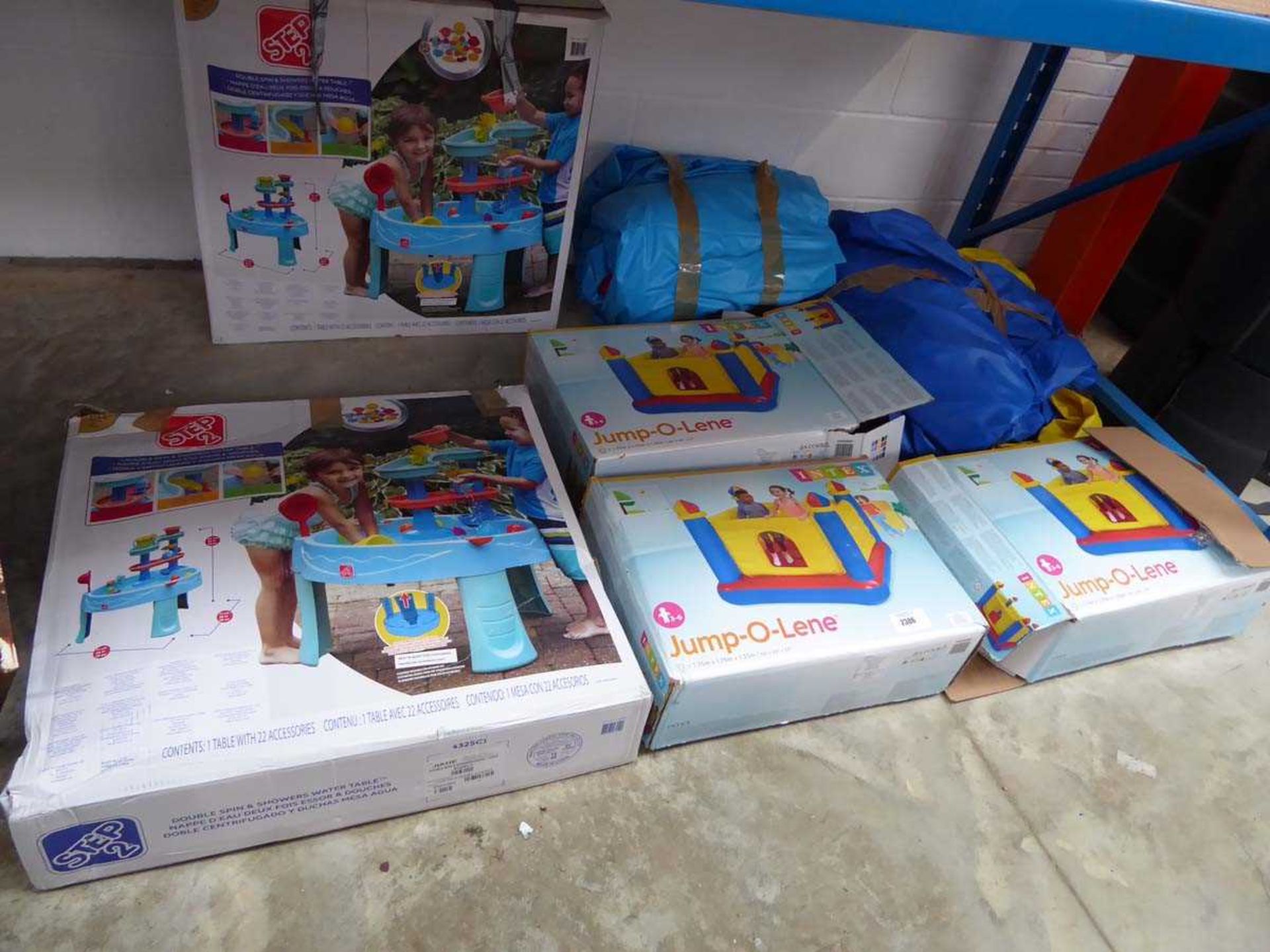 Quantity of various childrens outdoor inflatables and water activity tables