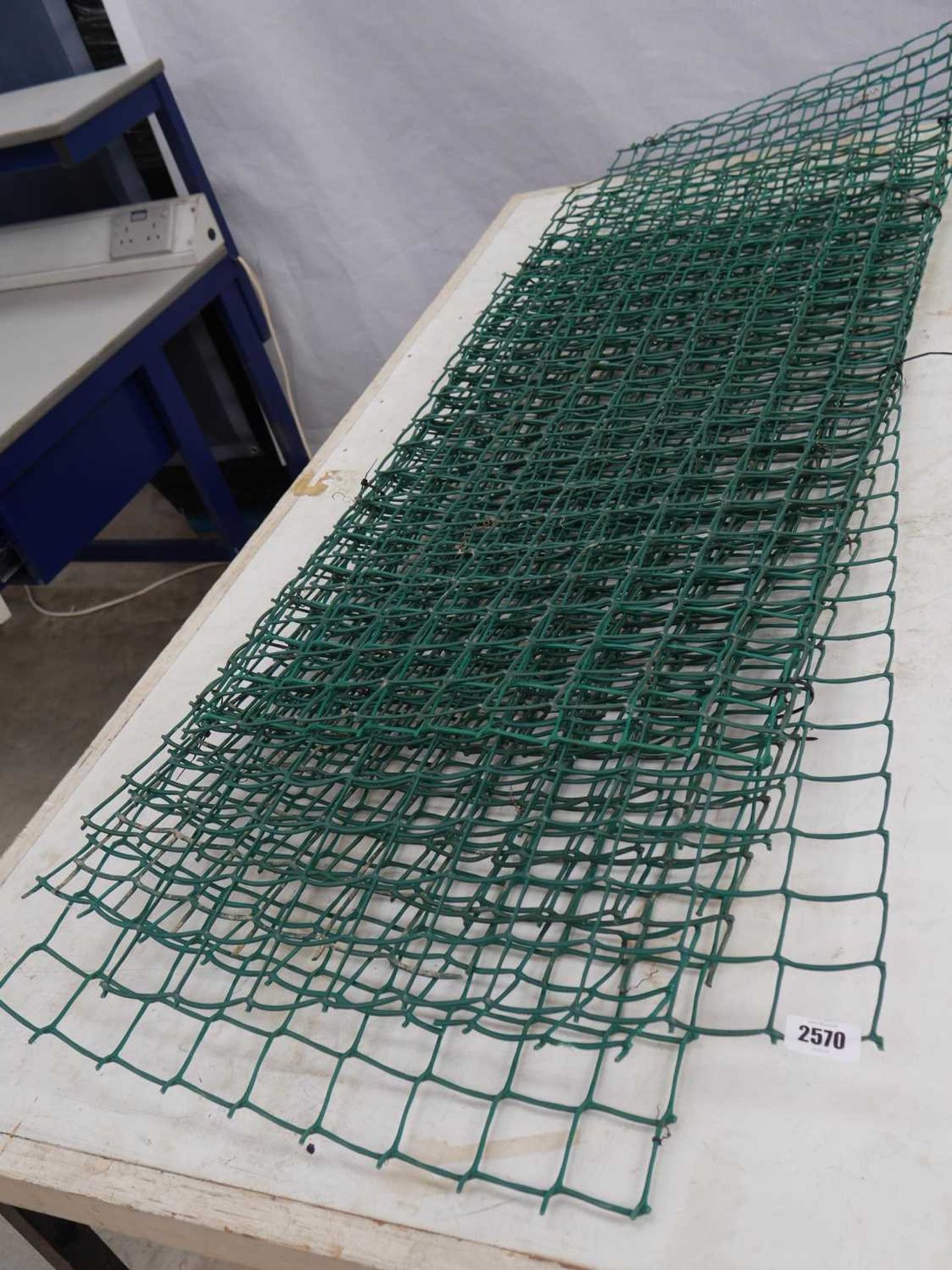 Quantity of green mesh trellis panels