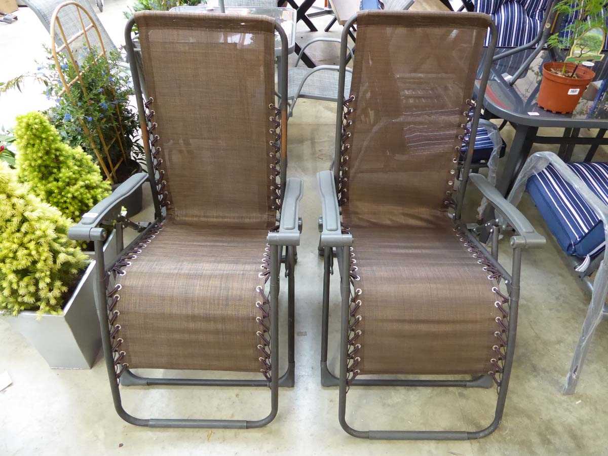 Pair of brown mesh back reclining garden sun loungers