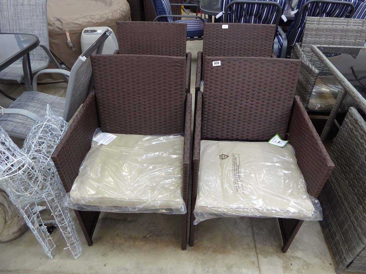 6 brown rattan garden armchairs each with beige coloured cushions